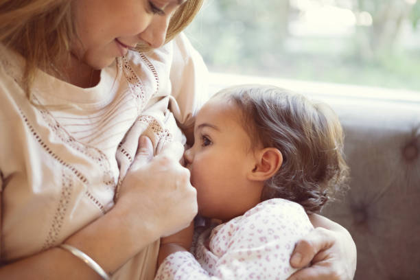 Mother breastfeeding her two year old daughter - Buenos Aires - Argentina